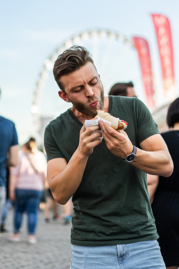 man eating street food